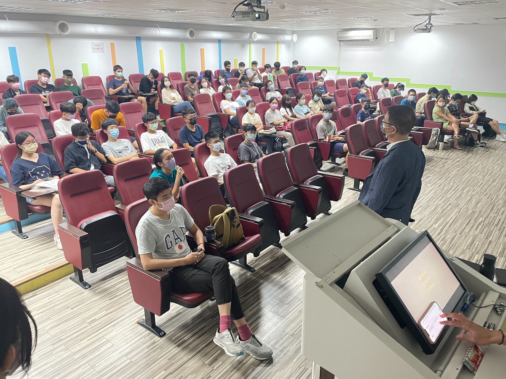 Mr. Wu interacting with a participant in the Q&A session.