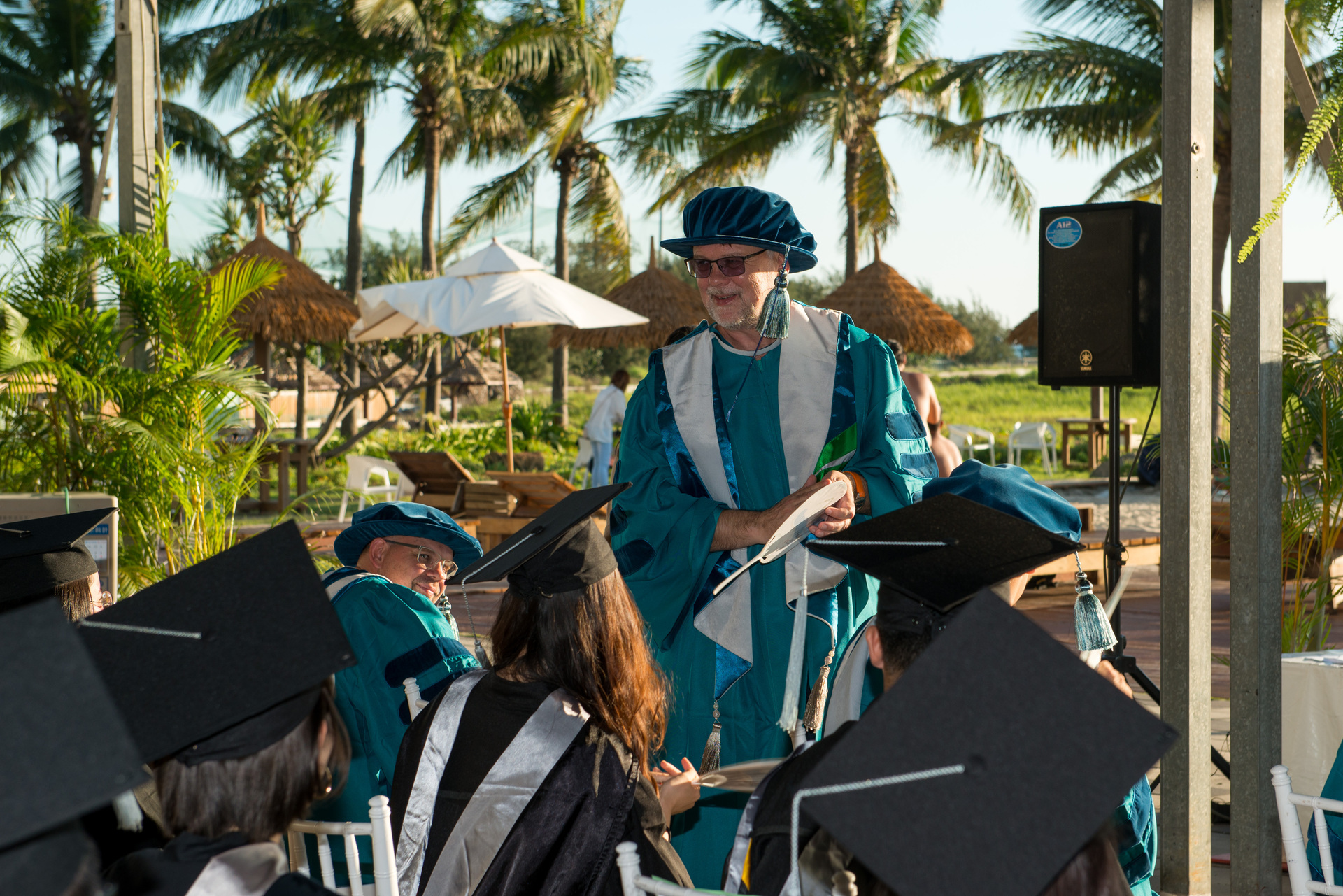 Professor Andersson greets students at NSYSU commencementImage