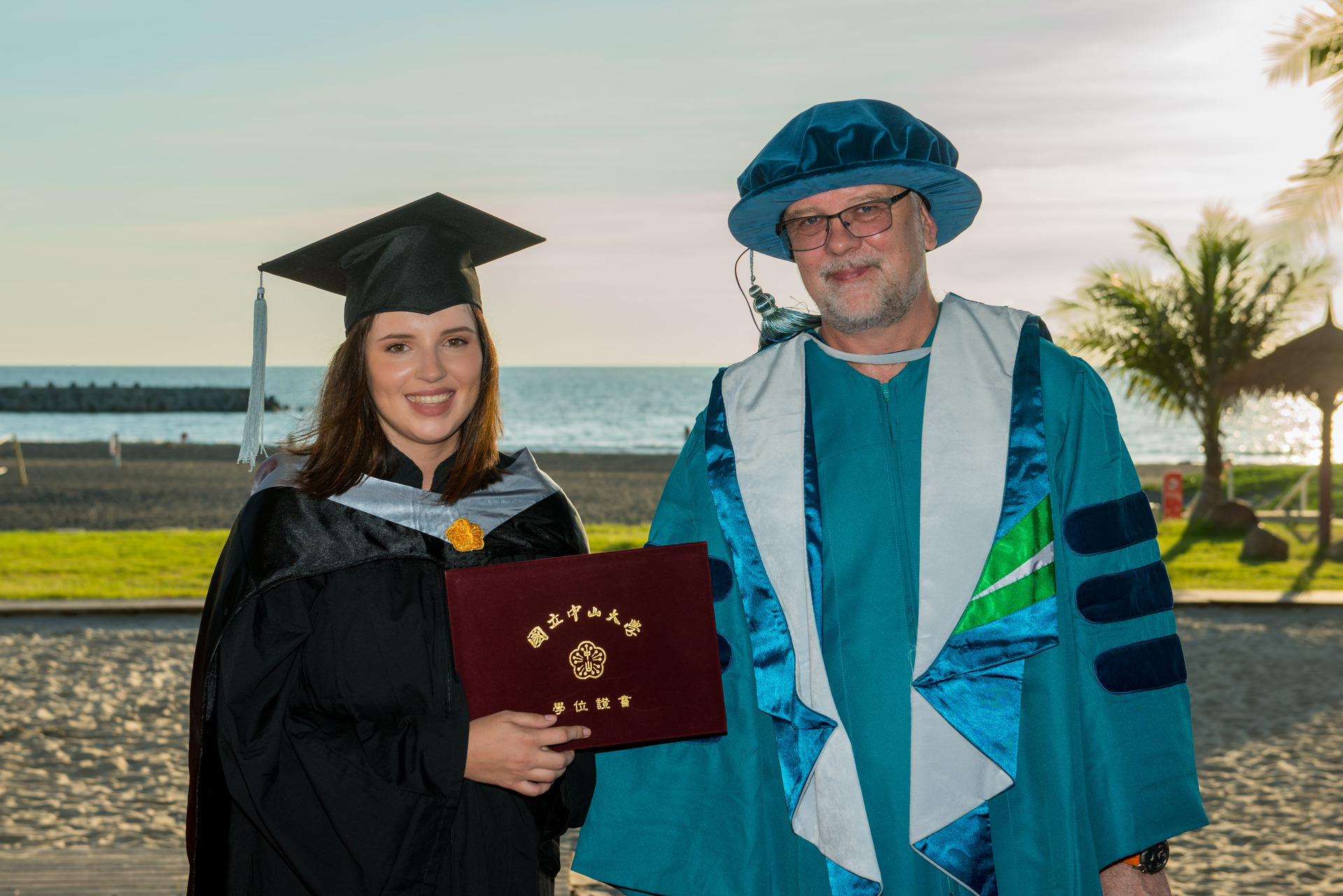 Professor Andersson celebrates with an international graduateImage