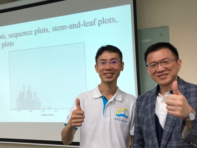Dr. Wong in his Ph.D. class polo shirt with Roger - the most enthusiastic Business Management Ph.D. class representativeImage