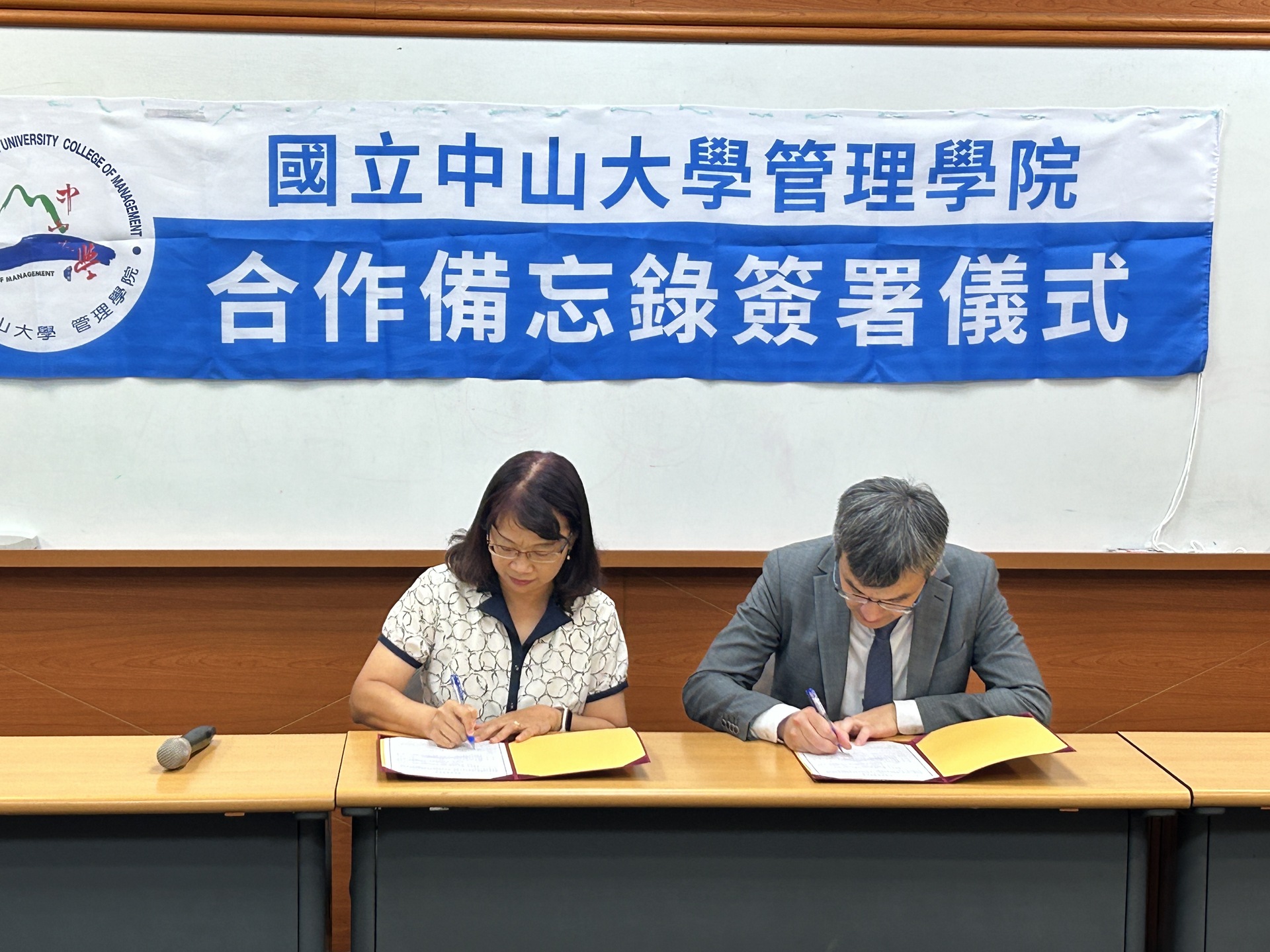 The moment of signingImage