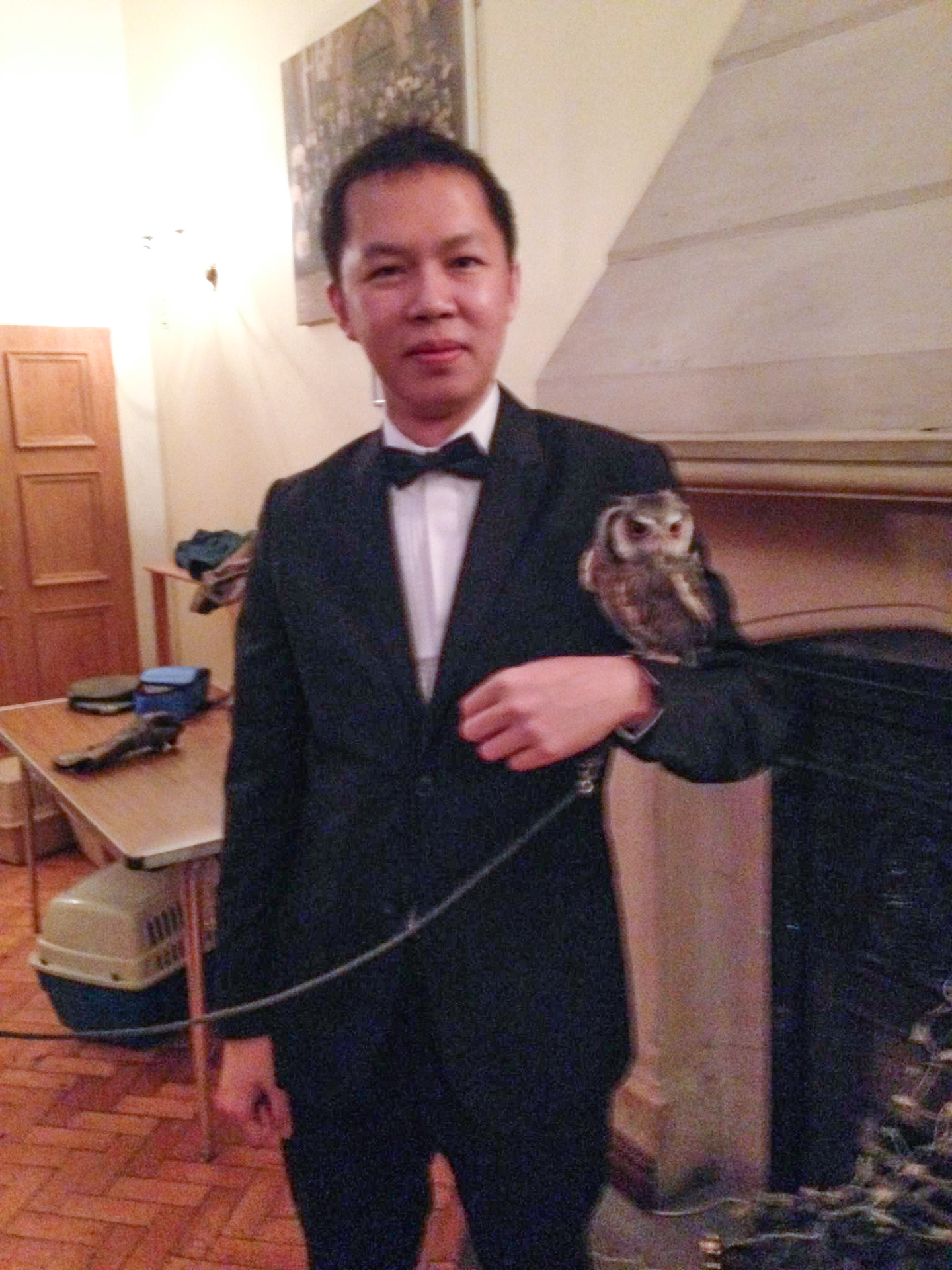 Professor Tsai poses with an owl at an annual Harry Potter-themed dinner of Homerton College at the University of Cambridge