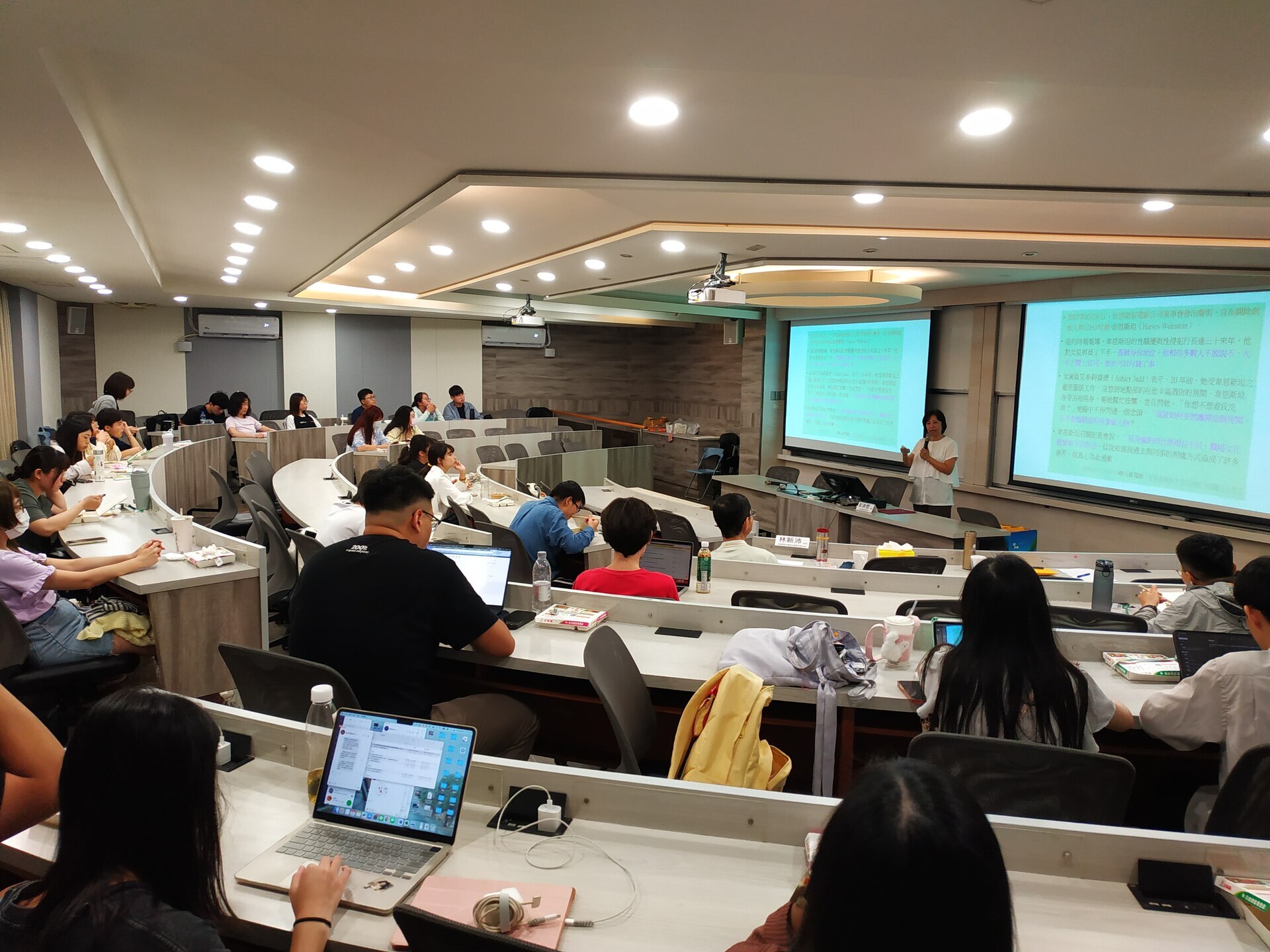 Faculty and students listening attentivelyImage