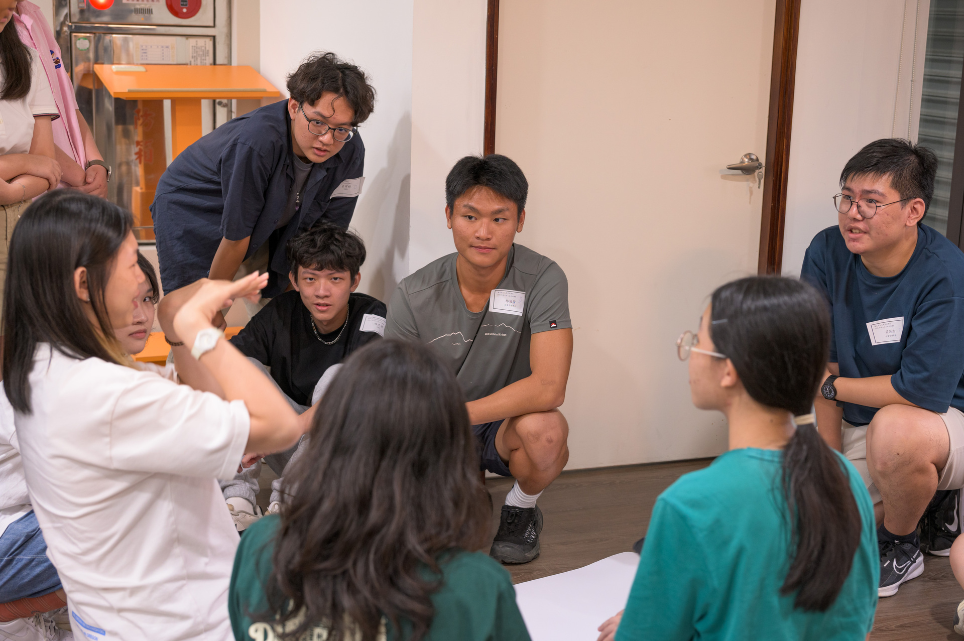 Team members in deep brainstorming mode, exchanging ideas and collaborating.Image