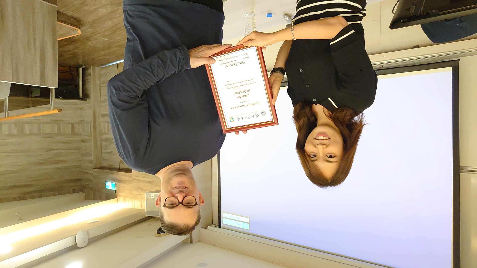 Mr. Kirk receives the certificate from Professor Jeeyeon KimImage