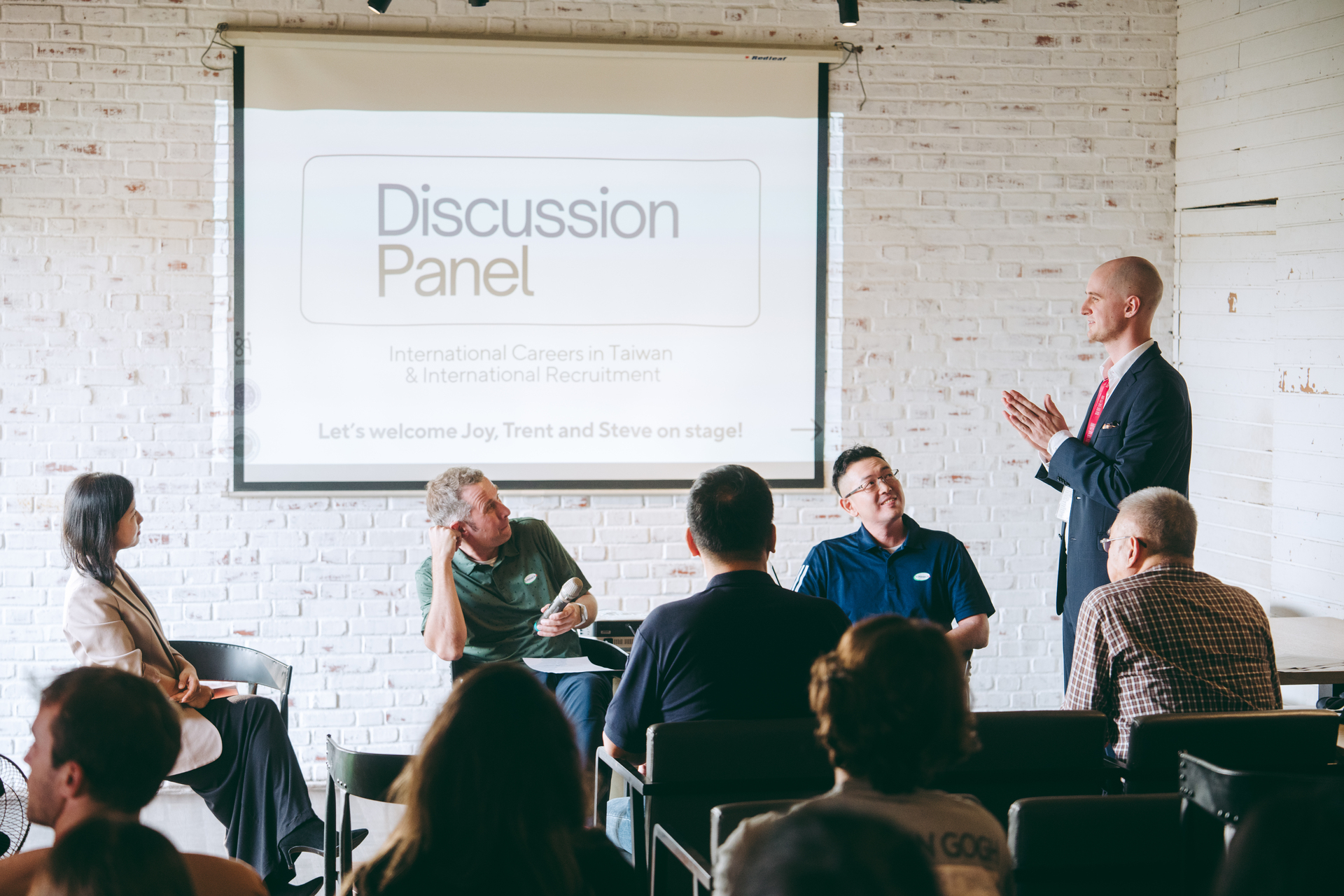 International alumni engage in a panel discussion with studentsImage