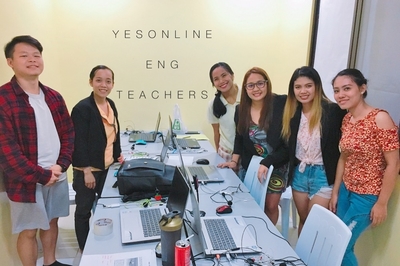 Chien-Hsiang Hung (first from left) posing with a Filipino English teacherImage