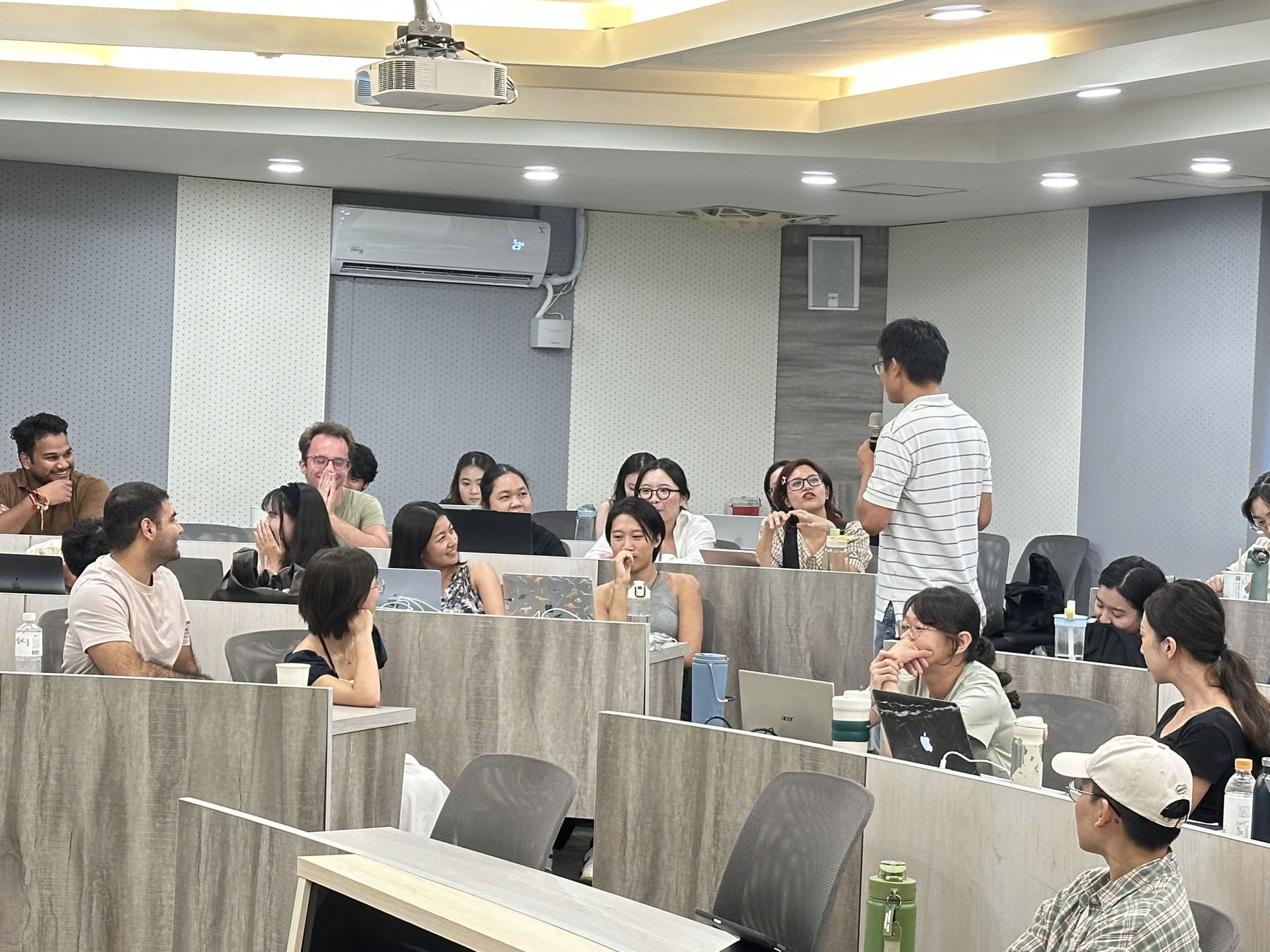 The students are actively engaging with the instructor.Image