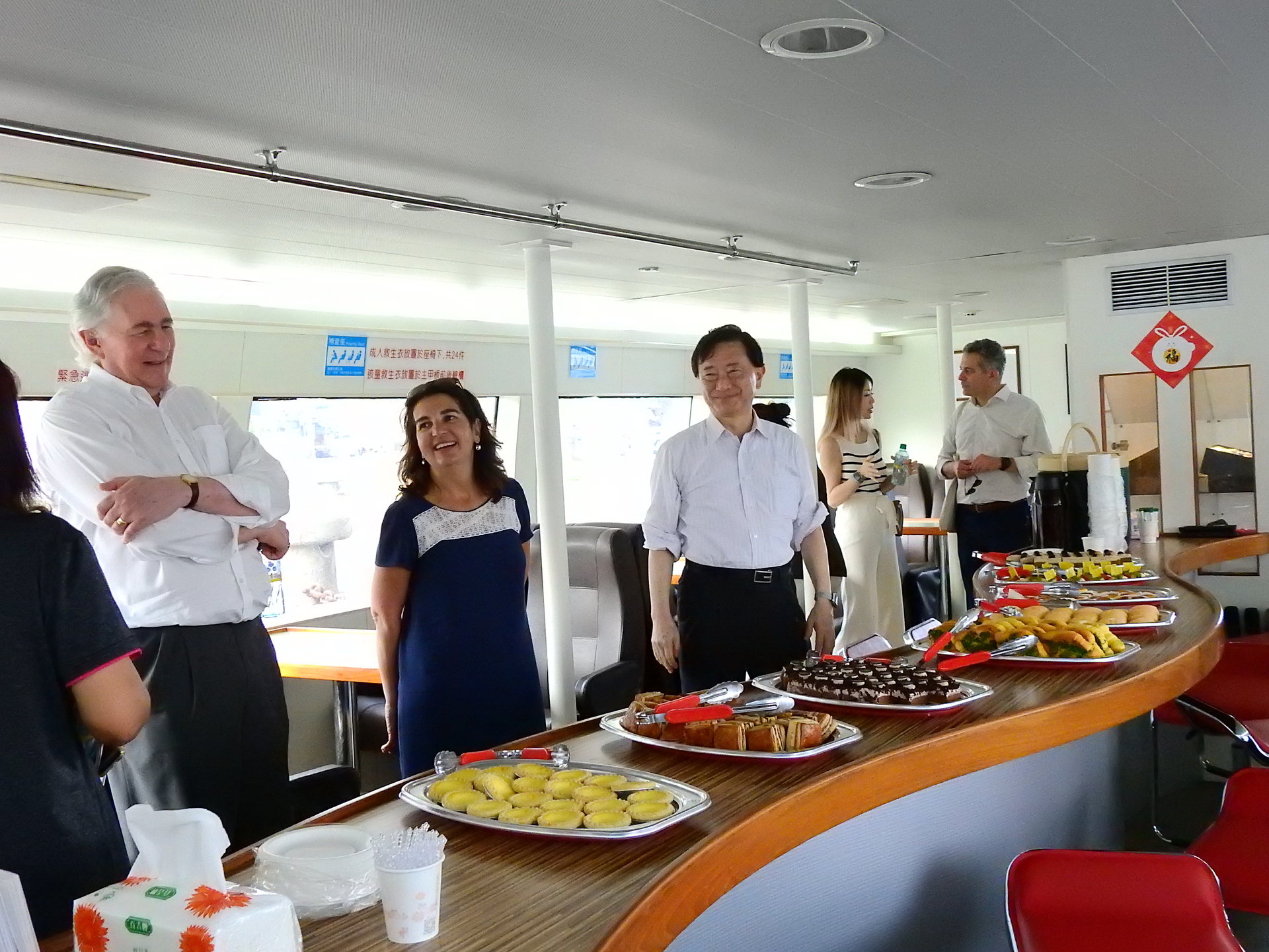 Board members having a good chat onboard the boat