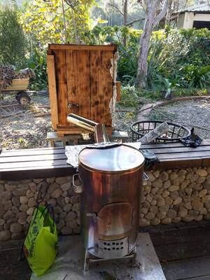 Homemade smoker box for smoking sausages and salmonImage