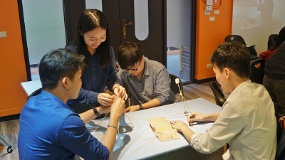The workshop participants teamed up to build the tallest tower in a challenge.